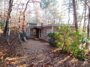 Cozy cabin nestled among the trees, offering a secluded retreat.