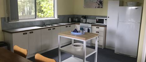 Microwave, oven, coffee/tea maker, cookware/dishes/utensils