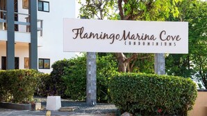 A sign for Flamingo Marina Cove Condominiums. - Newly Remodeled Beachfront Condo, Ground-Floor Terrace & Direct Access to Playa Flamingo (Santa Cruz, Guanacaste, Playa Flamingo)