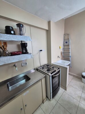 Fridge, microwave, stovetop, coffee/tea maker