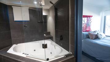 Combined shower/bathtub, jetted bath, hair dryer, toilet paper