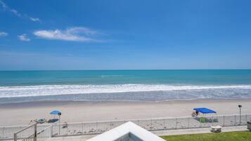 On the beach, sun-loungers, beach towels