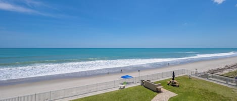 On the beach, sun-loungers, beach towels