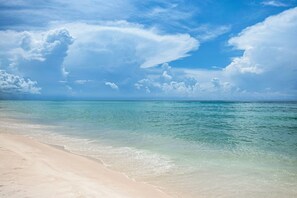 On the beach, sun-loungers