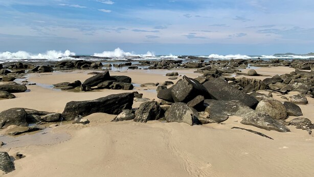 A rocky beach with waves crashing against the shore. - 35 YAMBA STREET Dog friendly (Yamba)