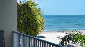 A balcony with a view of the beach and ocean. - Fall Savings! Gulf-View 2BR2BA 
Beach Condo with private balcony. (Indian Rocks Beach)