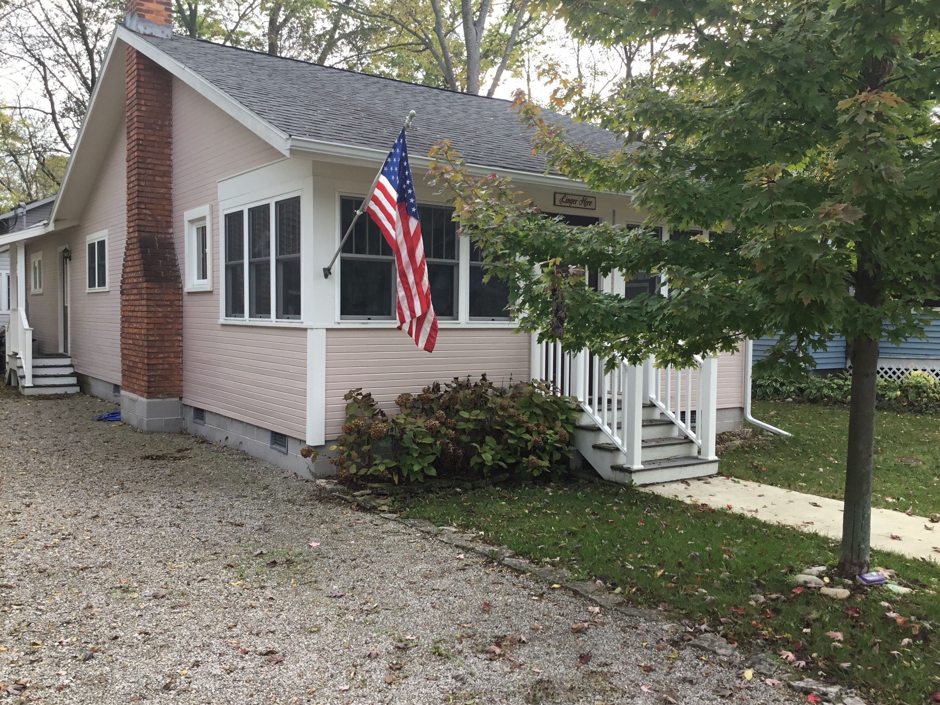 A picture perfect restored original cottage located inside the gates of Lakeside