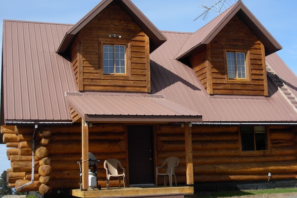 Log home on 5 acre view parcel. Just 5.8 miles from downtown Homer