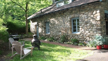 Outdoor eating area with grill and firepit