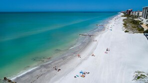 On the beach, sun loungers, beach towels