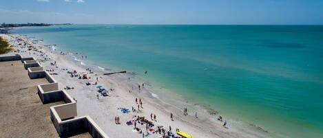 On the beach, sun loungers, beach towels