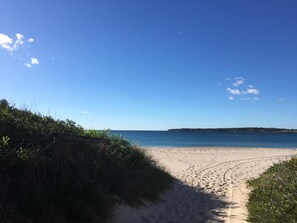 On the beach, sun-loungers