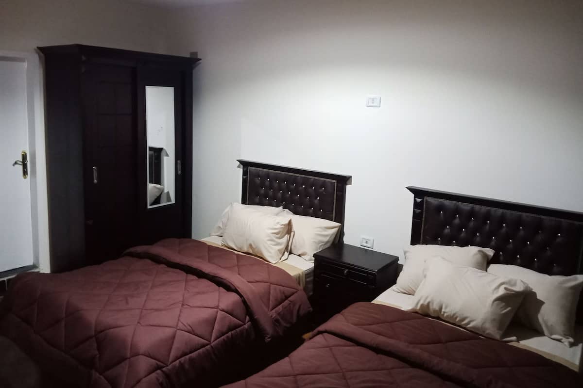 Twin Room | Blackout drapes, WiFi (free), bed sheets