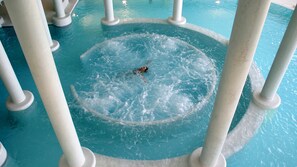 A water feature with a central circular area surrounded by white pillars, and the logo 'costa cool' visible in the bottom right corner.