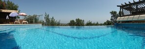 Outdoor pool, a heated pool, sun loungers