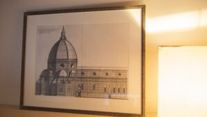 A framed architectural drawing of a building with a prominent dome, possibly a historical or significant structure. - Loft Conversion, aircon, walk to historic centre, sleeps 4+2, parking, free Wifi (Firenze)