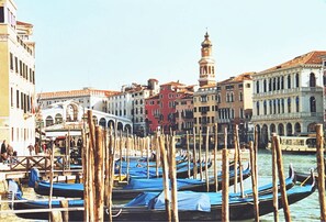 A canal with gondolas docked along the sides, surrounded by historic buildings with varied architecture. - Stylish Duplex with Stunning Private Courtyard in Dorsoduro (Venice)
