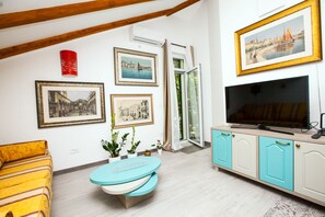 Penthouse, 2 Bedrooms | Living area | Flat-screen TV