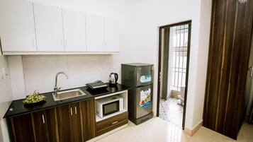 Fridge, stovetop, rice cooker, cookware/dishes/utensils