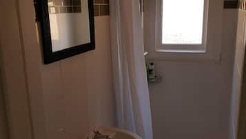 Combined shower/bathtub, hair dryer, towels, soap