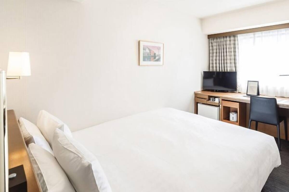 Desk, blackout curtains, free WiFi, bed sheets