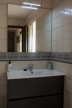 Bathtub, hair dryer, towels, soap