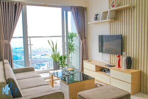 Deluxe Apartment, 2 Bedrooms, Bay View | Living room | 32-inch TV with cable channels - MHG Home Luxury Apartment (Ha Long)