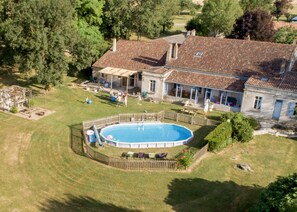 "Back of house" with pool, BBQs, terrace, conservatory, trampoline...