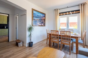 Enjoy meals in the dining area with a potted plant and city views.