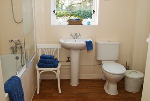 Bathtub, hair dryer, towels, soap