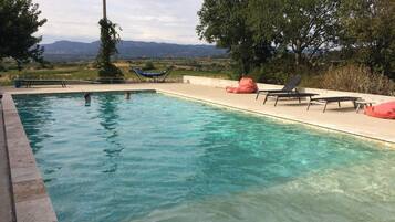 Outdoor pool, open 8:00 AM to 8:00 PM, pool umbrellas, sun loungers