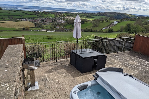 One of the highlights of this property is the private hot tub taking in the amazing views.
