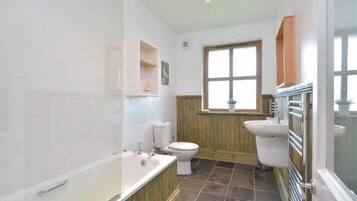 Combined shower/tub, hair dryer, towels, toilet paper