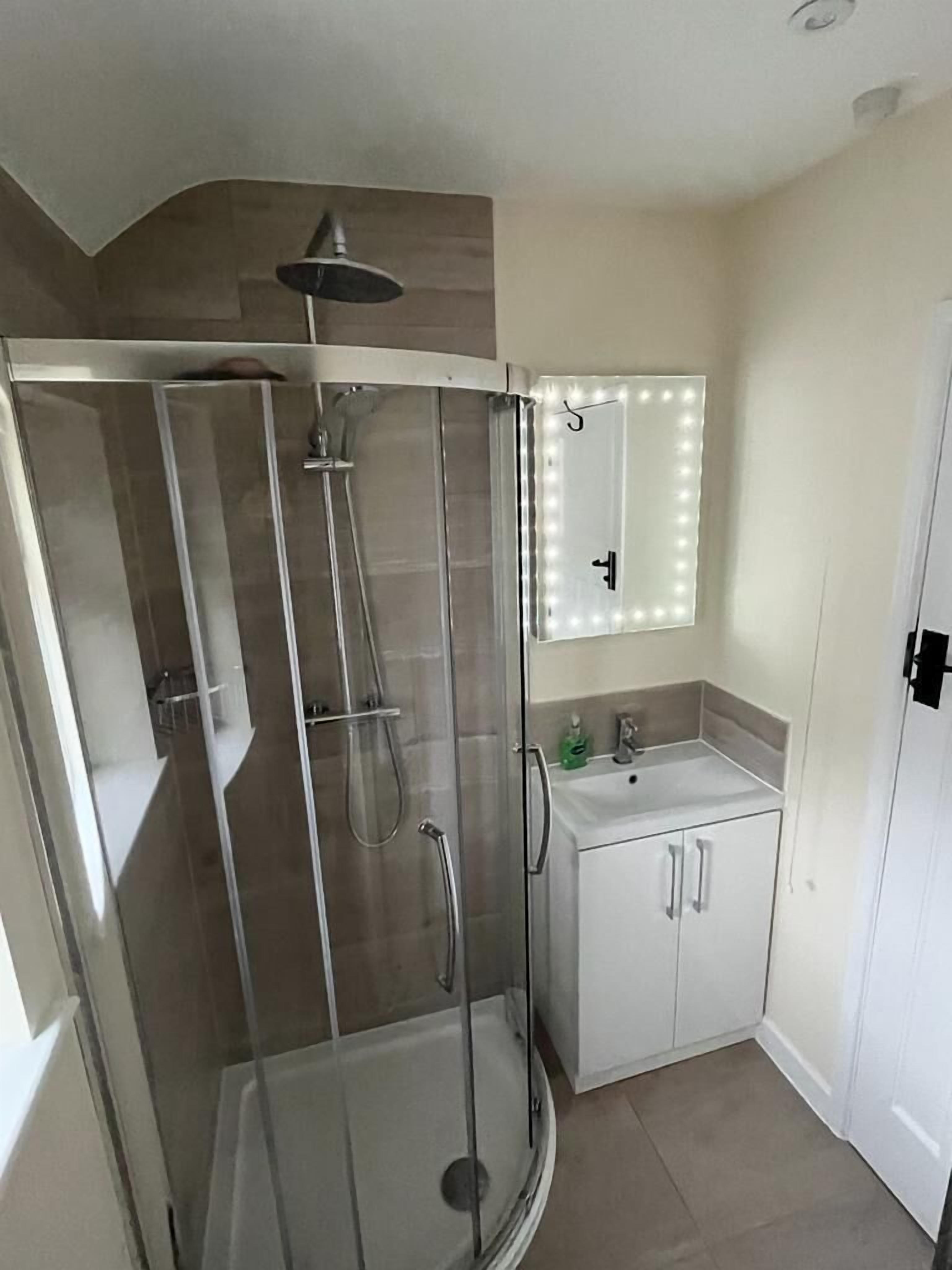 Combined shower/tub, hair dryer, towels, soap