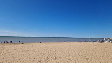 On the beach, sun-loungers