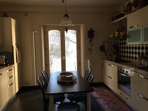 Enjoy meals in the kitchen with a stove, oven, and sink, and dine by the window with a view of the backyard.