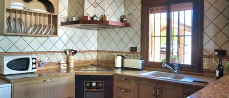 Coffee/tea maker, fridge, microwave, oven