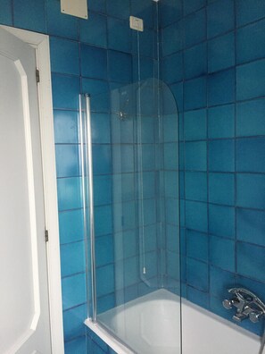 Bathtub, hair dryer, towels, soap
