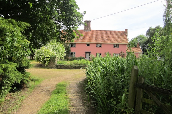 The Front of Abbey Farm with is long private drive.