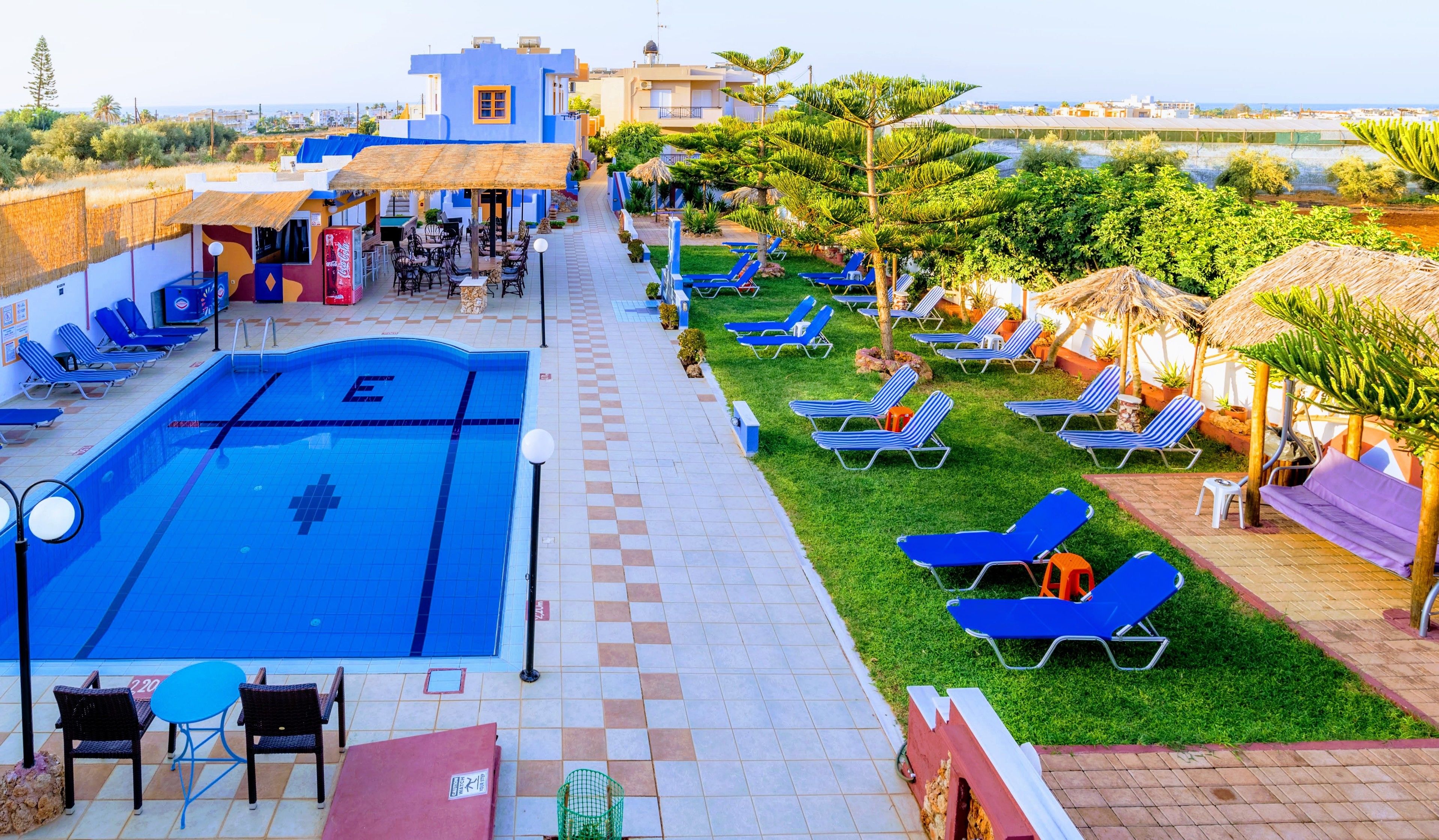 Seasonal outdoor pool, open 9:30 AM to 8:00 PM, pool umbrellas