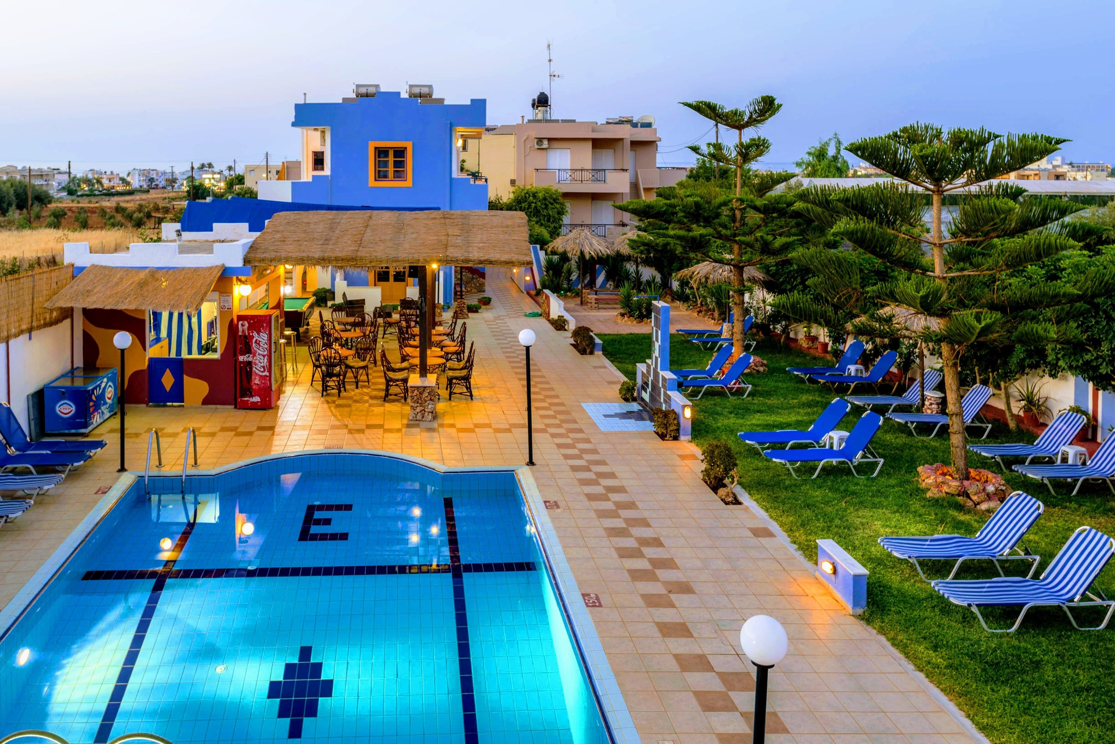 Seasonal outdoor pool, open 9:30 AM to 8:00 PM, pool umbrellas