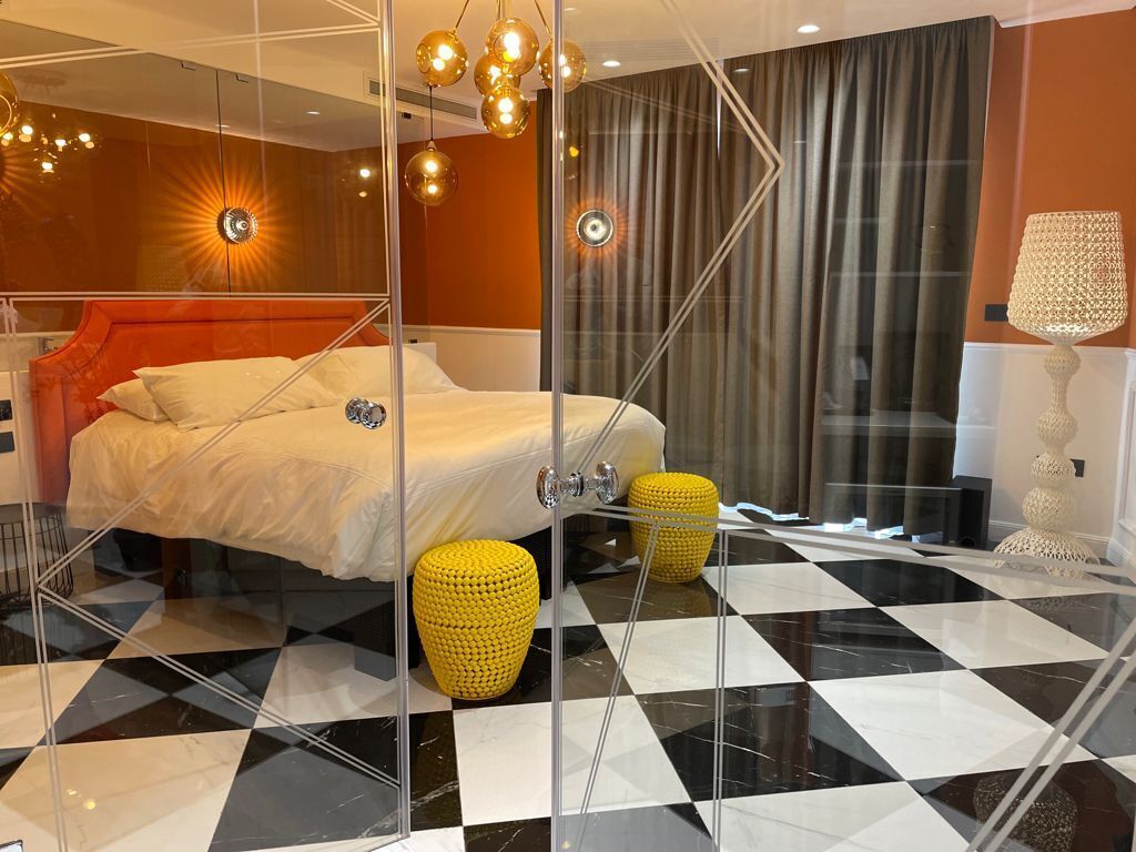 deluxe suite, 1 king bed with sofa bed | in-room safe, blackout curtains, soundproofing, iron/ironing board