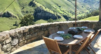 House with impressive stone lookout suspended in the mountain and views