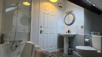 Combined shower/tub, hair dryer, towels, soap