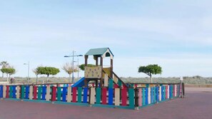 Kids can climb and slide in this playground area.