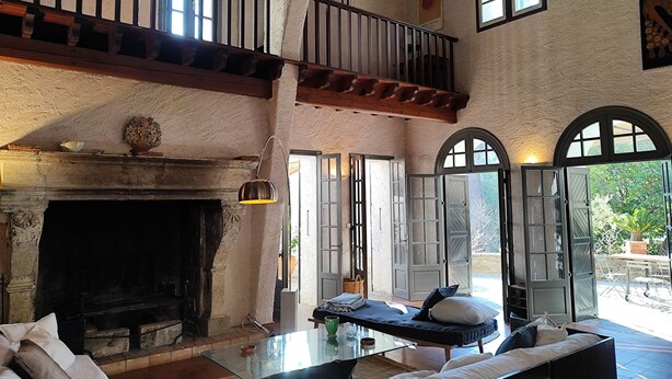 A spacious living area with a fireplace, a balcony, and large windows providing natural light. - Mansion - Port -vendres (Port-Vendres)