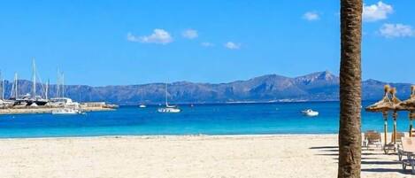 On the beach, sun-loungers, beach towels