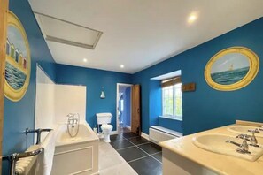 Bathtub, hair dryer, bidet, towels
