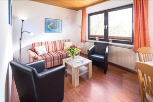 Apartment, 2 Queen Beds, Non Smoking, City View | Living area | Flat-screen TV