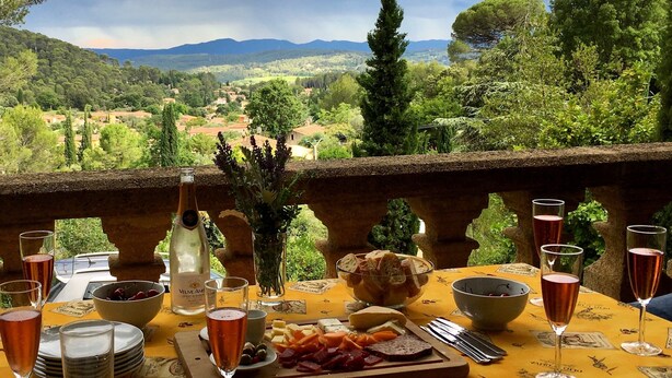 A table set for a meal with a view of a mountainous landscape. - Beautiful House With Tower Close To The Picturesque Town Of Lorgues. (Lorgues)